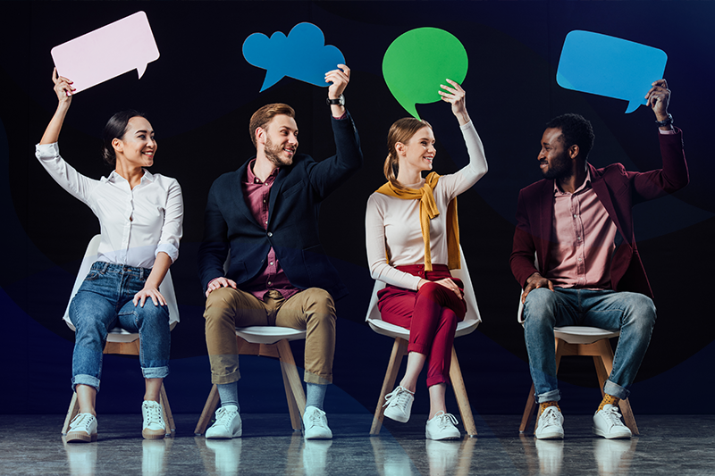 diverse group of employees joining together to communicate