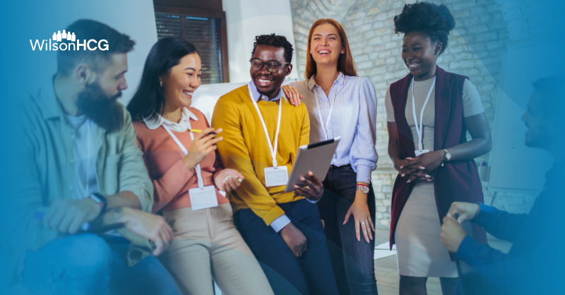 Diverse group of happy colleagues in modern office.